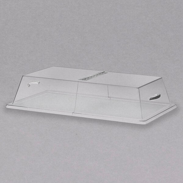 A clear plastic rectangular tray cover with a center hinge over a Cal-Mil bakery display tray.
