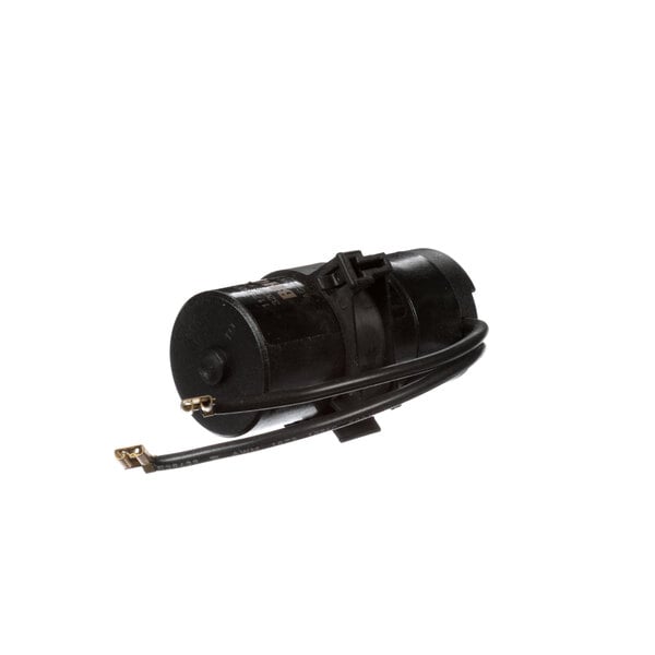 An AHT Cooling Systems start cap, a black round cylinder with wires.