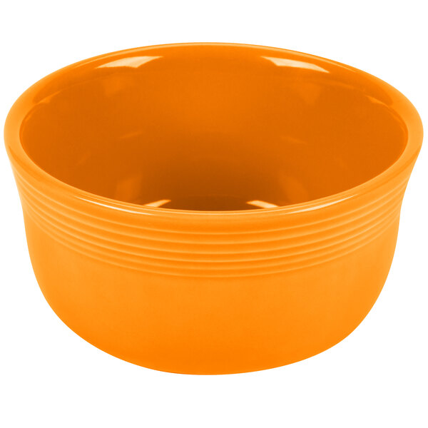 An orange bowl with a white background.