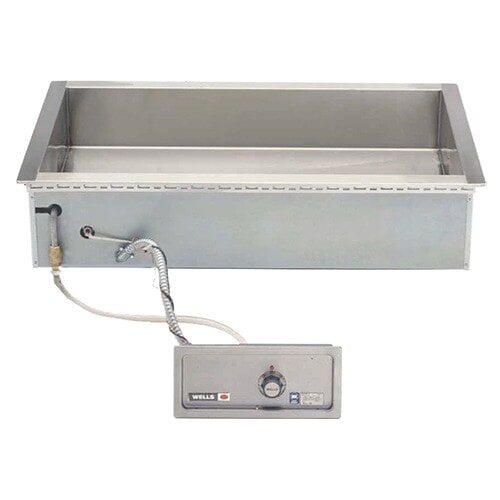 A Wells drop-in hot food well with a thermostat control panel over a stainless steel counter.