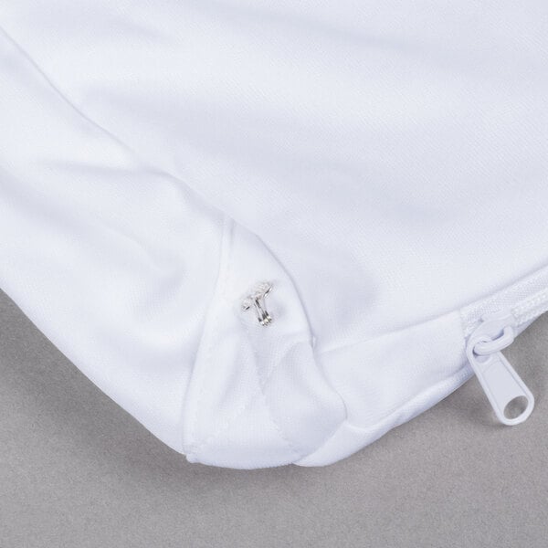 A white JT Eaton box spring cover with a zipper.