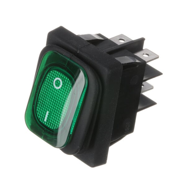 A close-up of a green switch with white text.