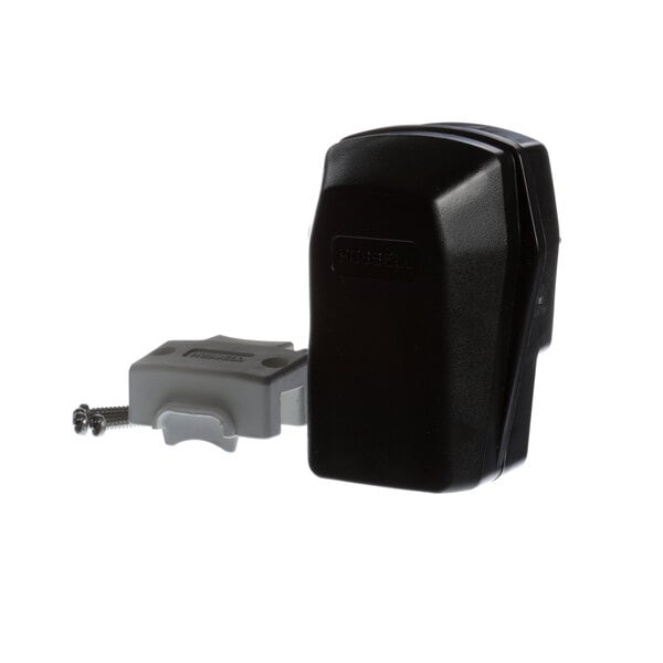 A black plastic Hubbell HBL8462C plug with white writing on it.