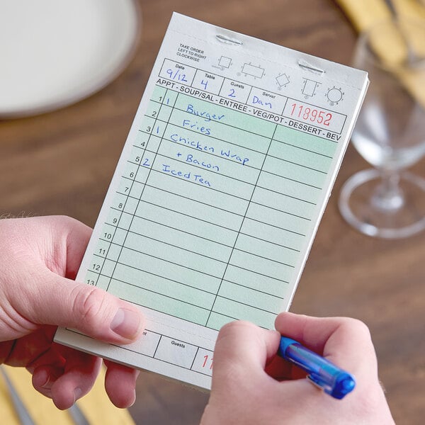 A green and white restaurant guest check pad with beverage lines and a bottom guest receipt section.