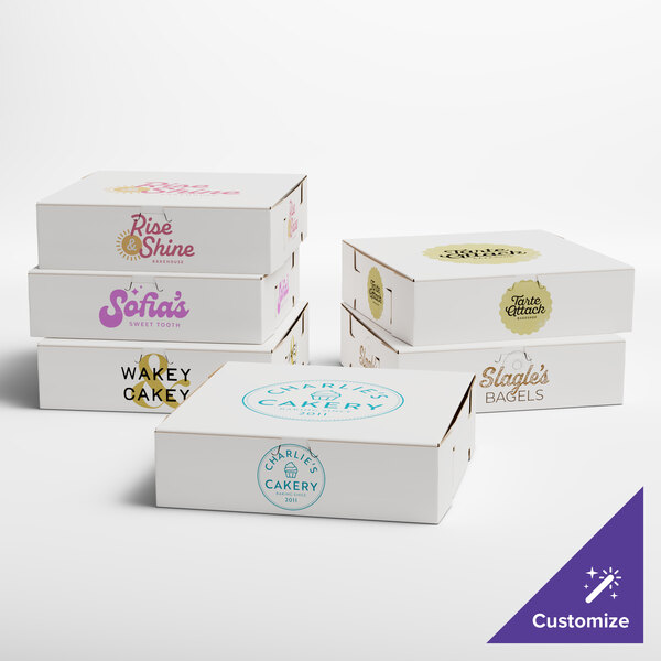 A group of white customizable bakery boxes with different designs.