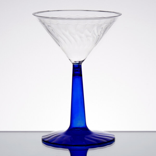 A clear plastic martini glass with a cobalt blue base.