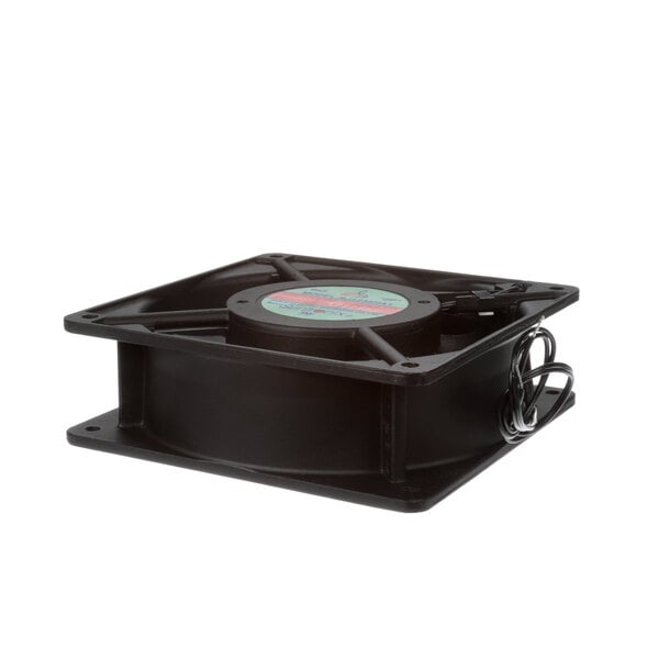 A black Leader EVAPMOTOR fan motor with a round blue label on a table.