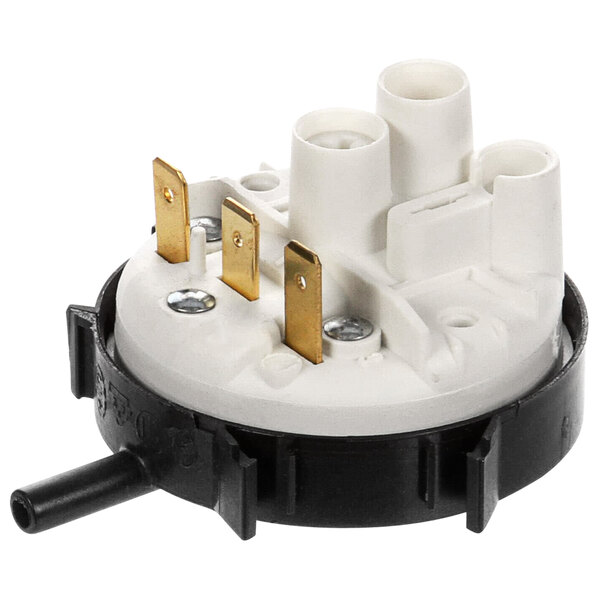 A round white and gold Champion pressure switch with black and gold connectors.