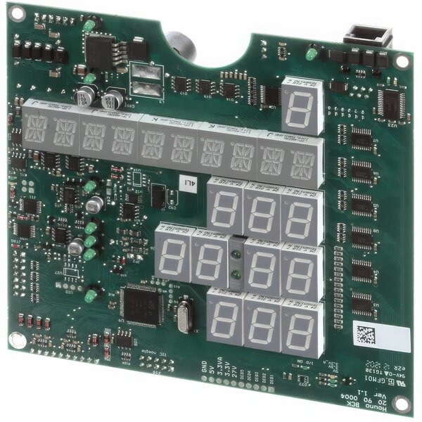 A green circuit board with multiple electronic components and white numbers with a number "61121" on a device.
