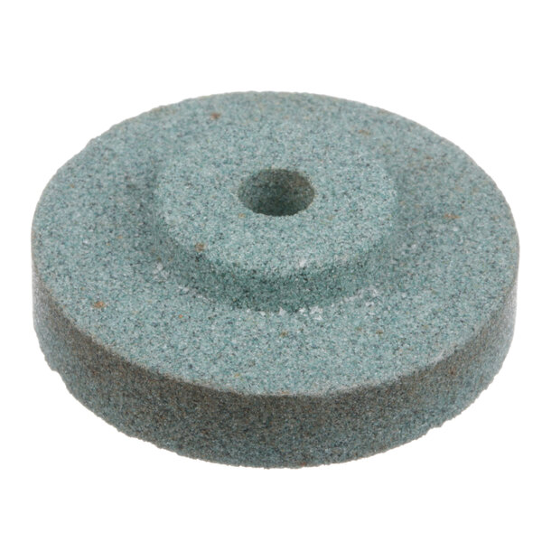 A grey circular General grinding stone with a hole in it.