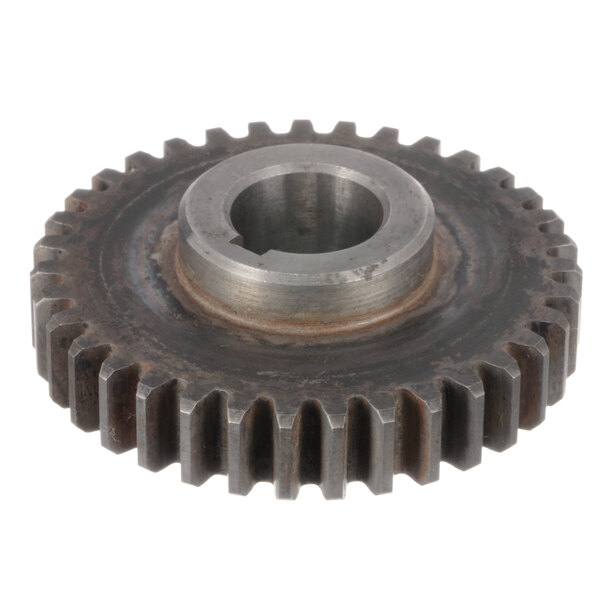 A close-up of an Omcan gear wheel.