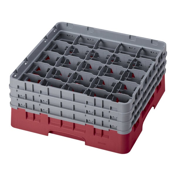 A red plastic Cambro glass rack with several compartments.