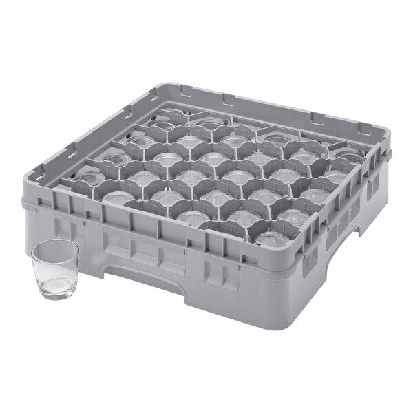 A grey plastic Cambro glass rack with six glasses inside.