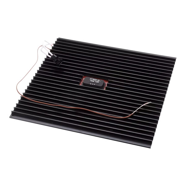 A black rectangular silicone heater with wires.