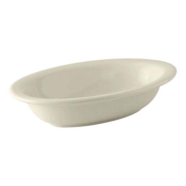 A white oval Tuxton china serving bowl.