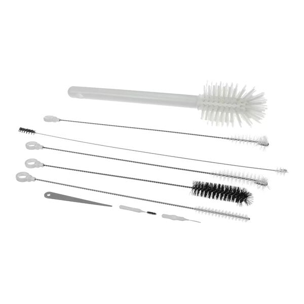 A set of various cleaning brushes and tools, including long-handled and small detail brushes, designed for equipment maintenance.