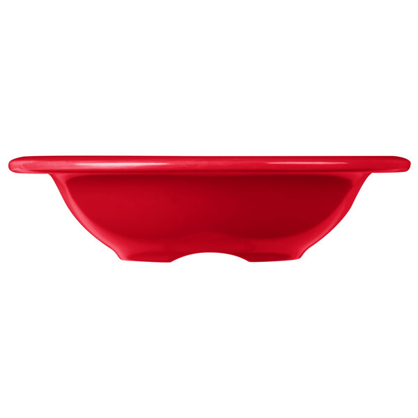 A red Carlisle melamine fruit bowl with a rim.