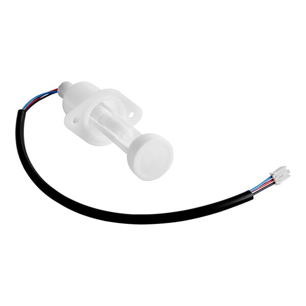 A white plastic object with a round base and wires.
