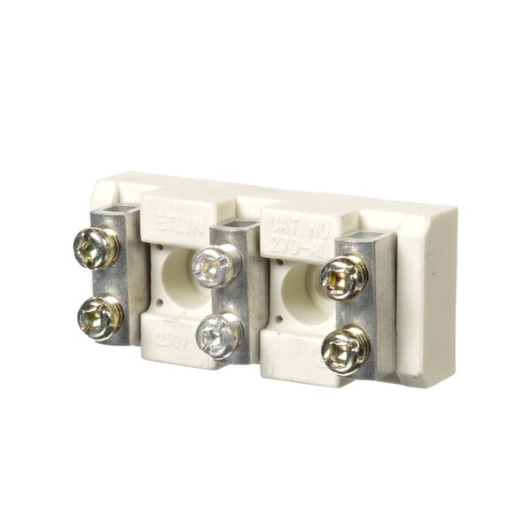 A close-up of a white Zesto terminal block with two metal screws.