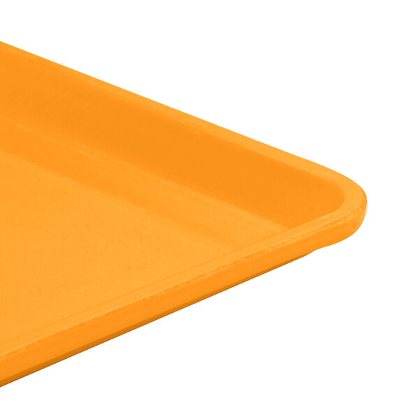 A close up of a mustard Cambro dietary tray.