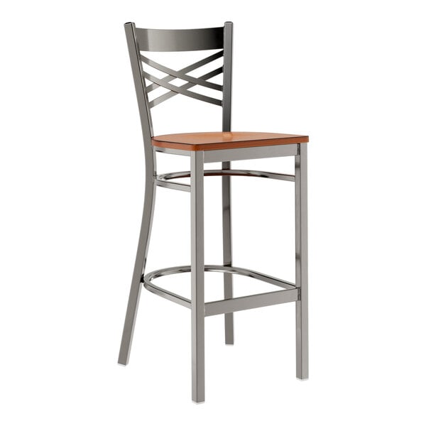 A Lancaster Table & Seating metal bar stool with a wooden seat.
