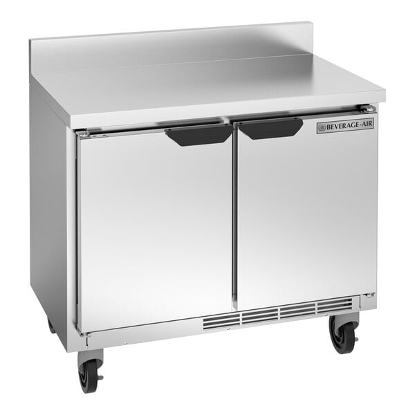 A stainless steel Beverage-Air worktop refrigerator with wheels.