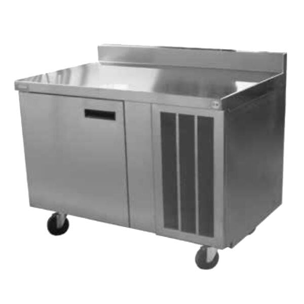 A Delfield stainless steel worktop refrigerator with a door on wheels.