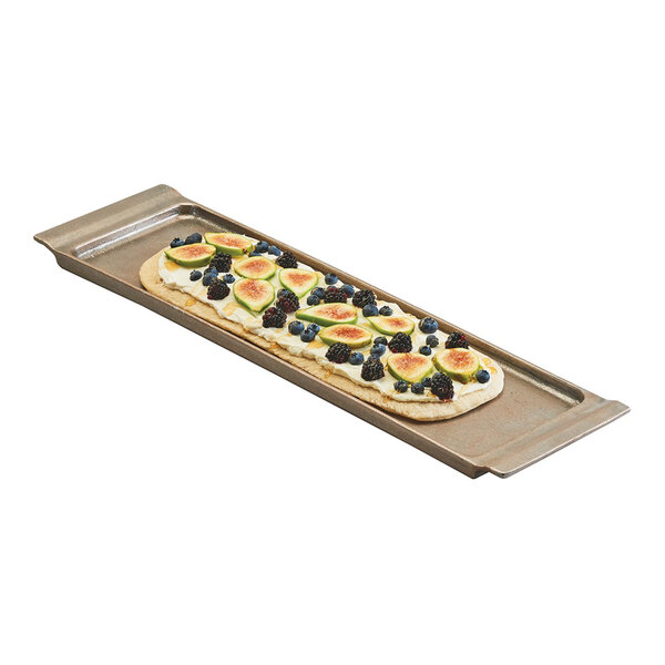 A rectangular aluminum platter with raised edges, displaying a flatbread topped with fruit.