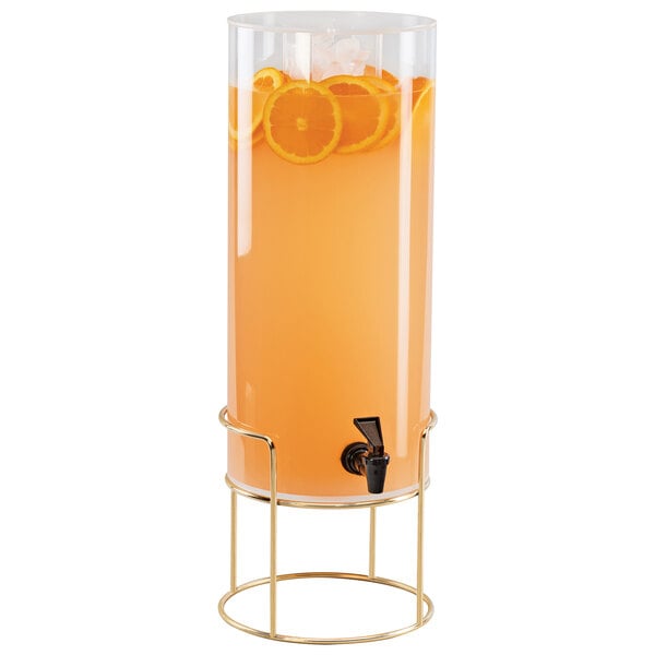 A Cal-Mil plastic beverage dispenser with orange juice and orange slices on it.