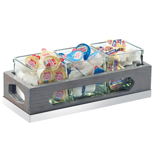 A Cal-Mil Ashwood wooden tray with three square glass jars inside.