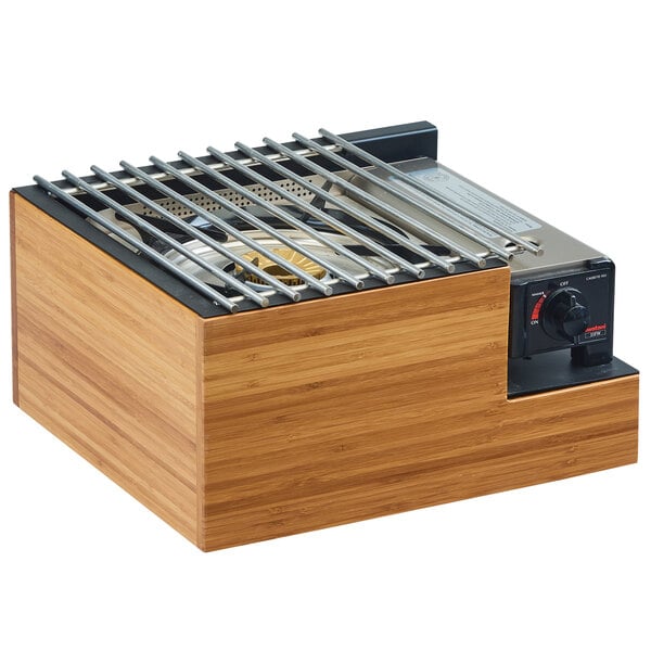 A Cal-Mil Bamboo Butane Burner Frame with a metal grate inside a wood box.