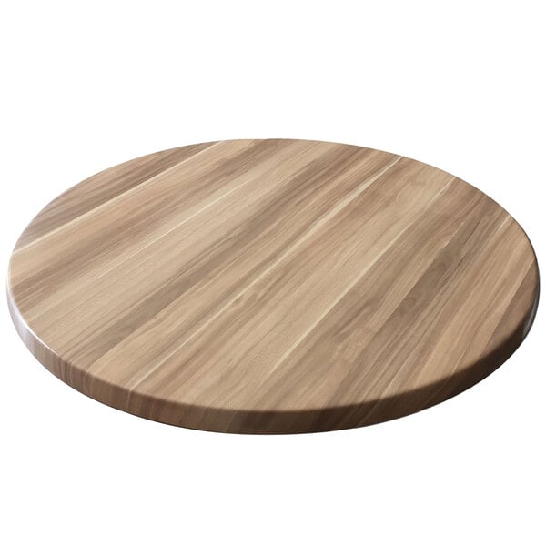 A round wooden table top with a natural finish on a white background.