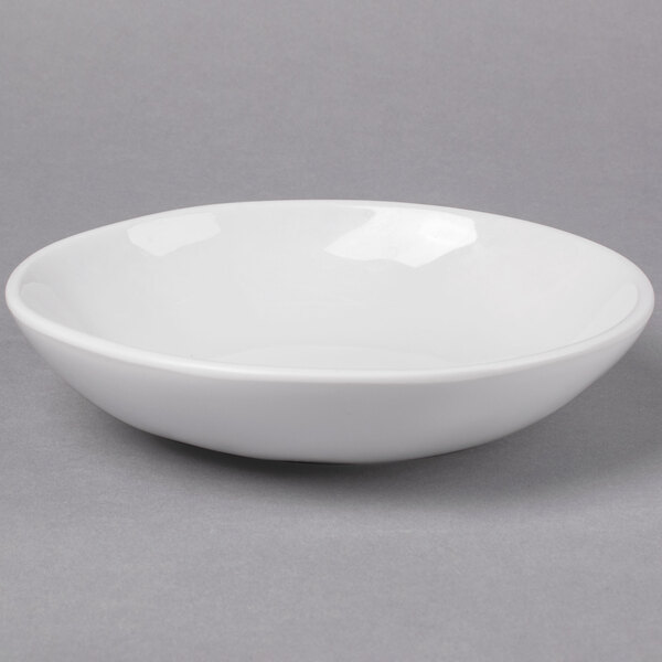 An American Metalcraft Cloud Coupe melamine bowl on a gray surface.