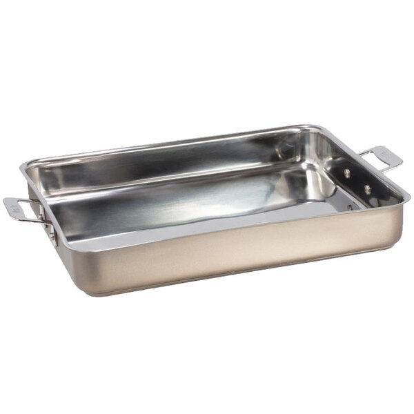 A silver stainless steel rectangular roasting pan with handles.