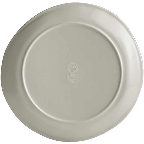 A white American Metalcraft Crave Shadow coupe melamine plate with a logo on it.