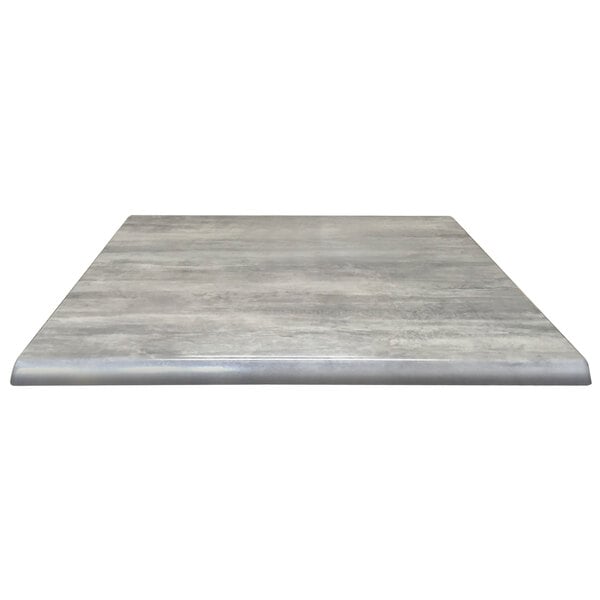 A close up of a grey square Holland Bar Stool table top.