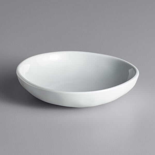 An American Metalcraft white melamine bowl on a gray surface.