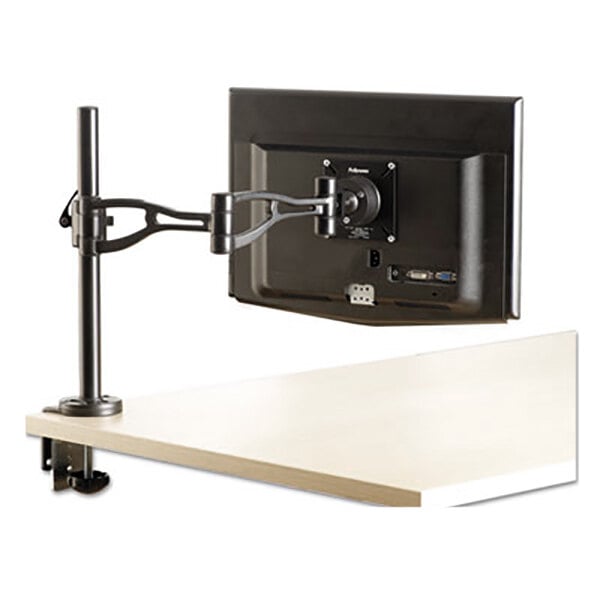 A close-up of a black Fellowes adjustable depth monitor arm on a white table.