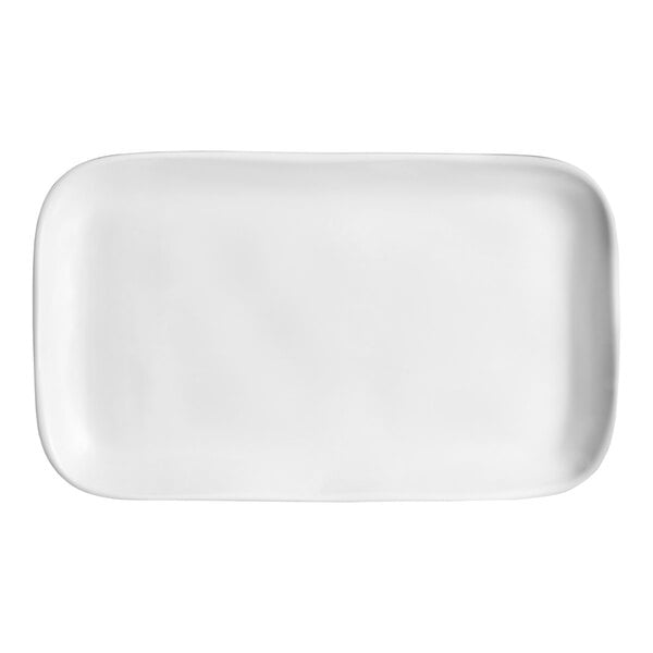 A plain, white, rectangular serving platter with rounded corners.