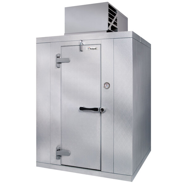 A Kolpak indoor walk-in freezer with an open door.