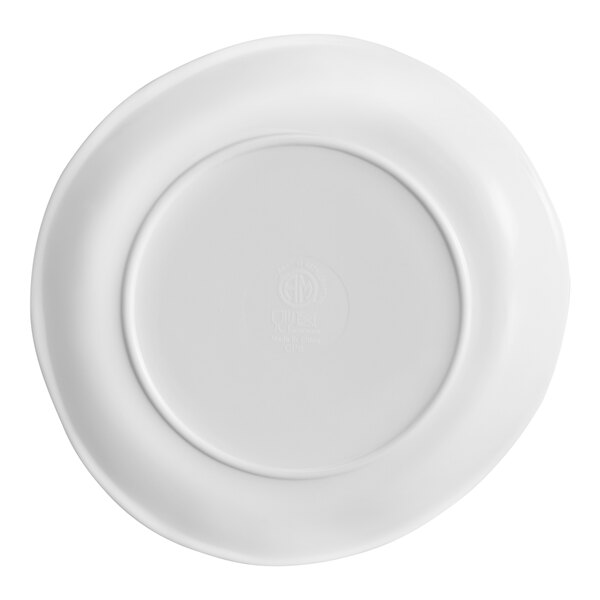 A white plate with a slightly irregular, cloud-like edge viewed from the bottom.