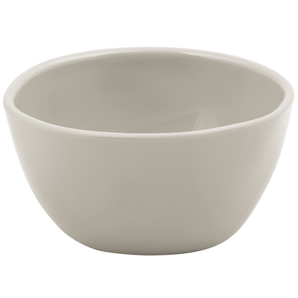 A white American Metalcraft melamine bouillon cup with a small rim on a white surface.