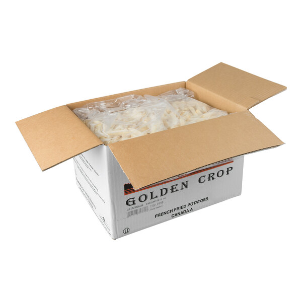 A cardboard box labeled 'Golden Crop' containing six 5-pound bags of 3/8 inch skin-on straight cut French fries.