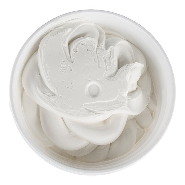 A container filled with smooth, white, creamy frosting viewed from above.