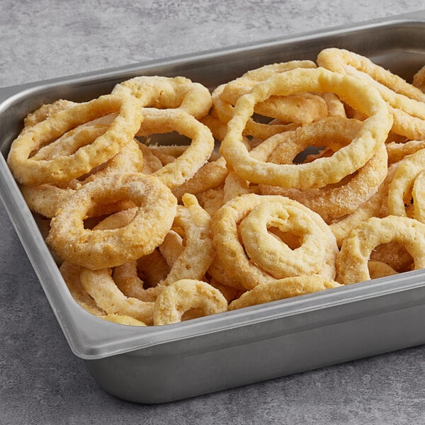 A tray of Steak Cut Beer Battered Onion Rings on a metal tray.