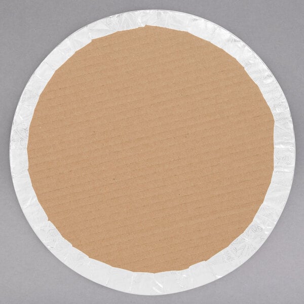 A circular cardboard plate with a white rim.