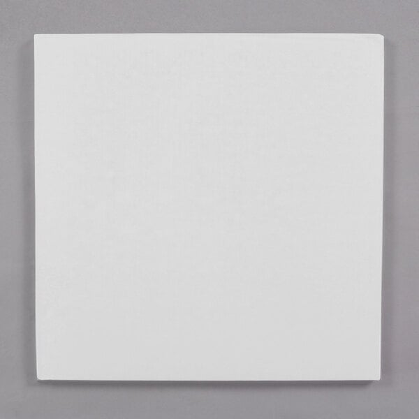 A white square Enjay cake drum.