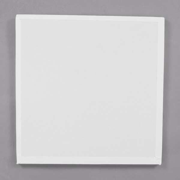 A white square Enjay cake drum.