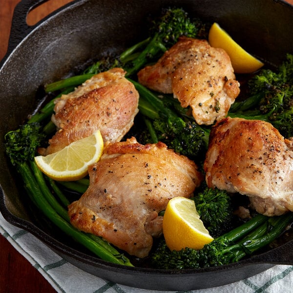 chicken thighs with lemon slices and greens