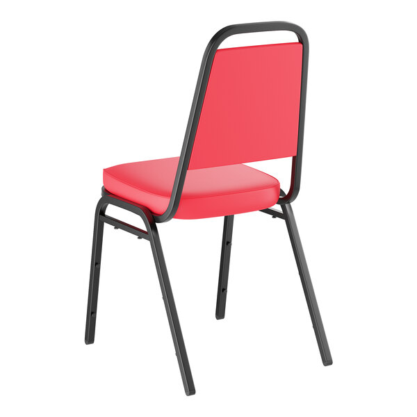 A red stackable chair with a 2-inch padded seat and black metal frame.
